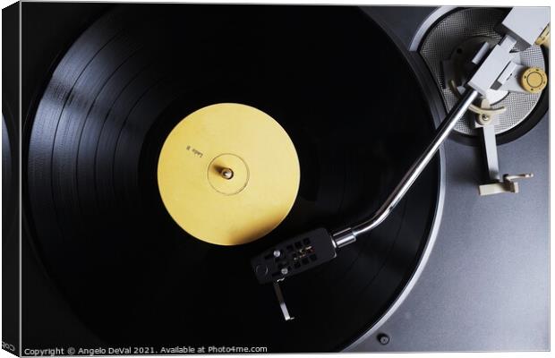 The Nostalgic Sounds of a Yellow Label Vinyl Recor Canvas Print by Angelo DeVal