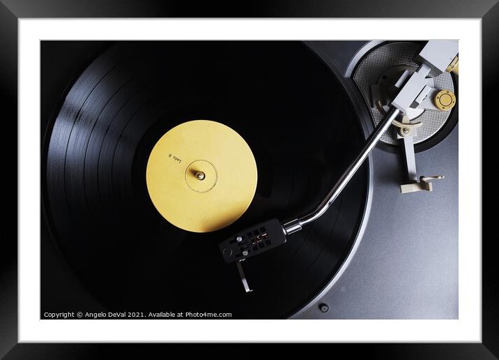 The Nostalgic Sounds of a Yellow Label Vinyl Recor Framed Mounted Print by Angelo DeVal