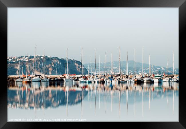 Boats water reflections Framed Print by Paolo Cordoni
