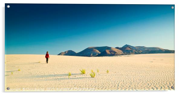 A lone figure walking on Sand dunes Corralejo  Acrylic by Chris Warren
