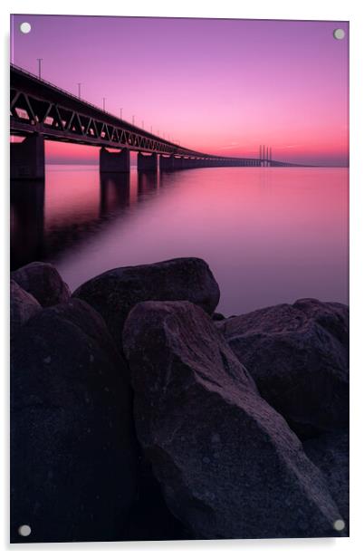 Oresunds Bridge and Rocky Shore at Sunset Acrylic by Antony McAulay