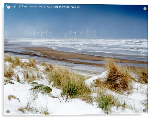 Cold conditions on a deserted beach with snowy cli Acrylic by Peter Jordan