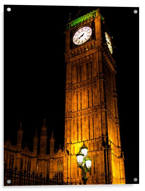 A clock tower lit up at night Acrylic by henry harrison