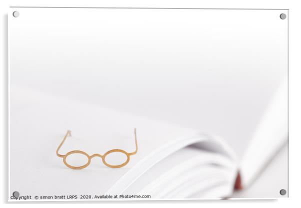 Tiny reading glasses on open book Acrylic by Simon Bratt LRPS