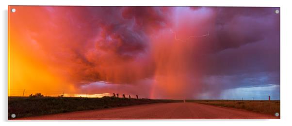 Sunset thunderstorm with rainbow and lightning. Acrylic by John Finney