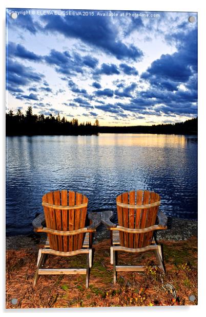 Wooden chairs at sunset on lake shore Acrylic by ELENA ELISSEEVA