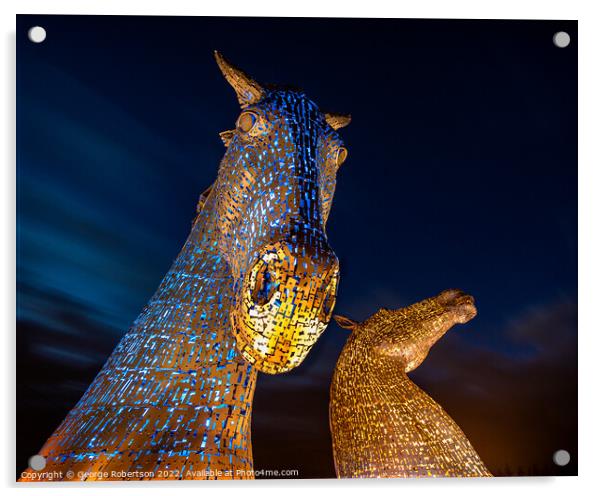 The Kelpies light up in Blue and Yellow colours in support of Uk Acrylic by George Robertson