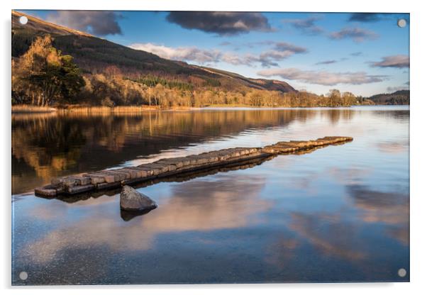 The old stone jetty on the shore of a very still L Acrylic by George Robertson