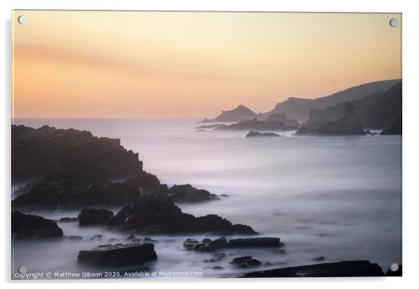 Beautiful long exposure landscape image of sea over rocks during vibrant sunset Acrylic by Matthew Gibson
