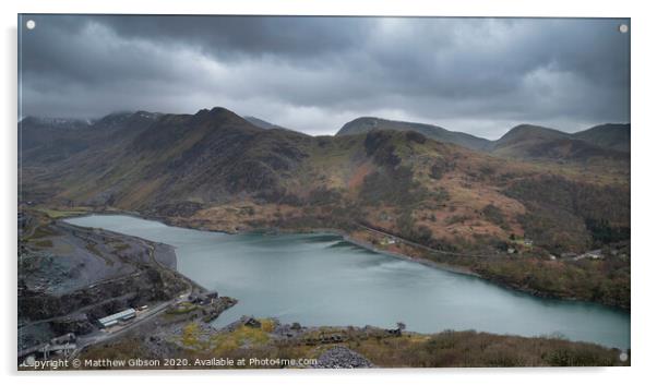 Beautiful landscape image of Dinorwig Slate Mine and snowcapped Snowdon mountain in background during Winter in Snowdonia with Llyn Peris in foreground Acrylic by Matthew Gibson