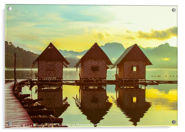 Sun rising over cute little wooden huts perched on Acrylic by  