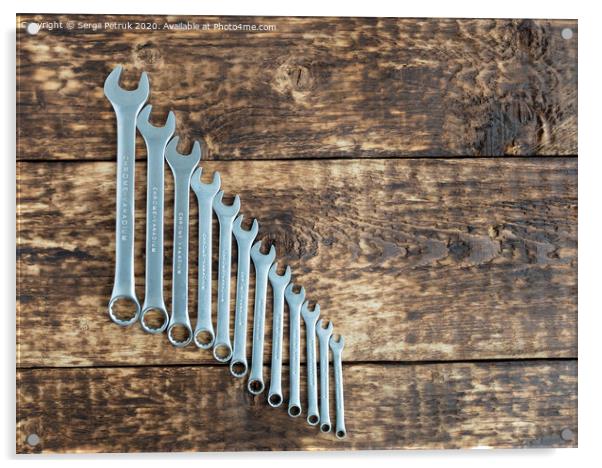set of wrench against old wooden boards background Acrylic by Sergii Petruk