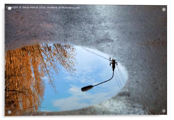 Reflection of the sky, the silhouette of a street lamp and a tree sunlit in a puddle on asphalt. Acrylic by Sergii Petruk
