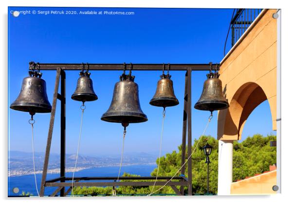 Closeup of bells against a blue sky, mediterranean pine and sea coast in blur, Greece, August 2019. Acrylic by Sergii Petruk