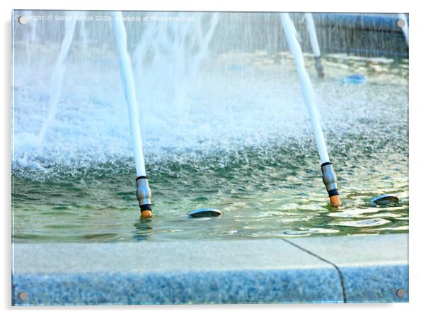 Powerful jets of water in a city fountain made of polished granite burst from metal nozzles. Acrylic by Sergii Petruk