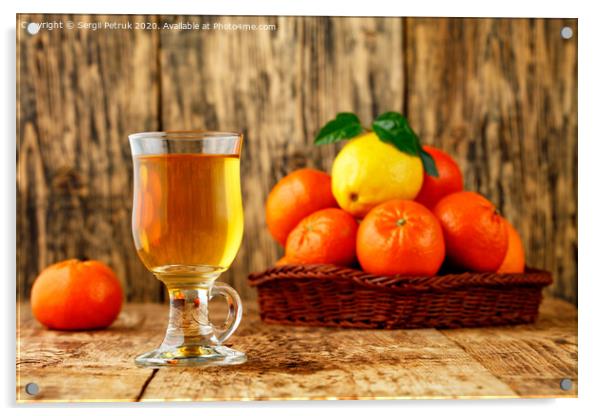 Citrus tea in a glass cup on a background of mandarin and lemon fruits in blur. Acrylic by Sergii Petruk