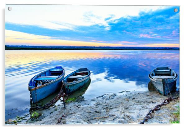 Old blue-green boats moored to the shore by old iron chains and stand on the shore of a calm river against the background of the morning horizon. Acrylic by Sergii Petruk
