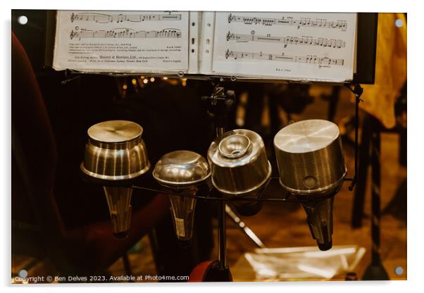 Trumpet mutes in a row with sheet music on a stand Acrylic by Ben Delves