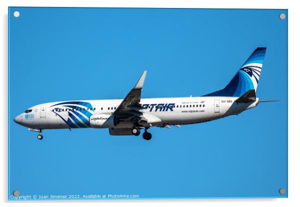 Boeing 737-800 passenger aircraft of the airline Egyptair flying before landing against sky Acrylic by Juan Jimenez