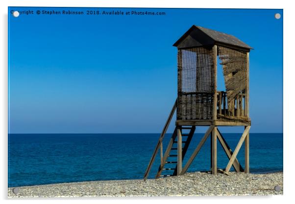 A rustic wooden lifeguard's hut on a shingle beach Acrylic by Stephen Robinson