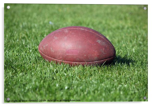 old American football ball on green grass Acrylic by goce risteski