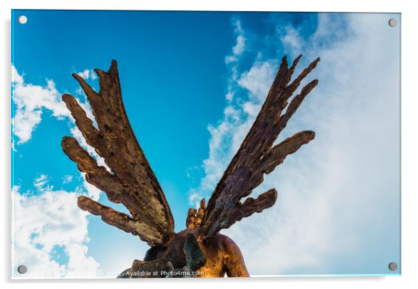 A sculpture of an angel, rear view of its wings against the sky. Acrylic by Joaquin Corbalan
