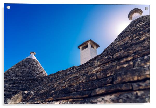 Stone tiles cover the roofs of the trulli in Alberobello, an Italian city to visit on a trip to Italy. Acrylic by Joaquin Corbalan