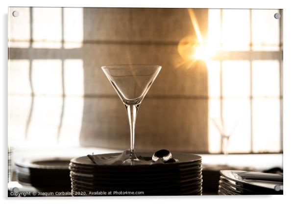 Empty glass cup with sun flares background in a restaurant. Acrylic by Joaquin Corbalan