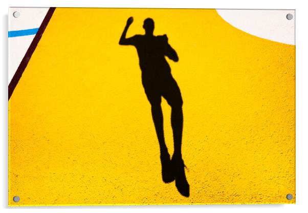 Shadow and silhouette of a man jumping on a yellow painted floor. Acrylic by Joaquin Corbalan