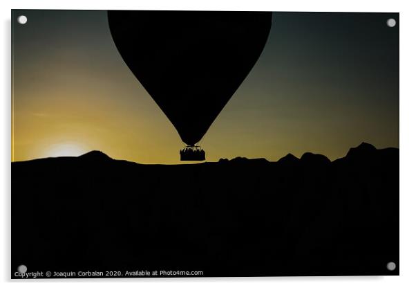 Silhouette of travelers and tourists flying over mountains at sunset in an aerostatic balloon. Acrylic by Joaquin Corbalan
