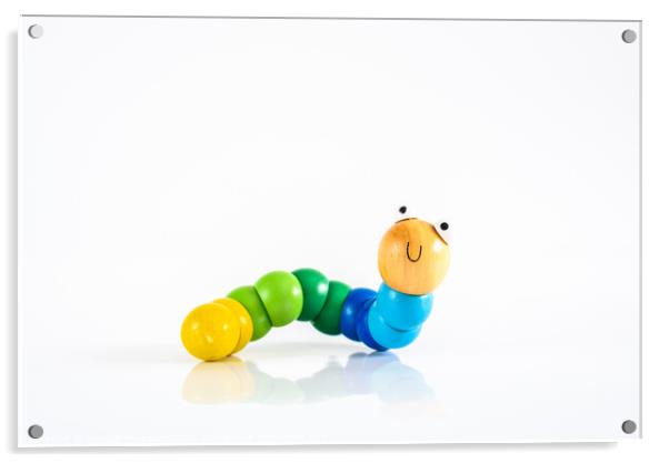 Toy caterpillar with smile, to illustrate concepts of infant intestinal health. Acrylic by Joaquin Corbalan