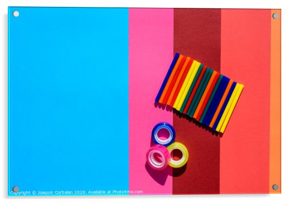 Colored background seen from above with plastic bars to use in crafts and stationery. Acrylic by Joaquin Corbalan