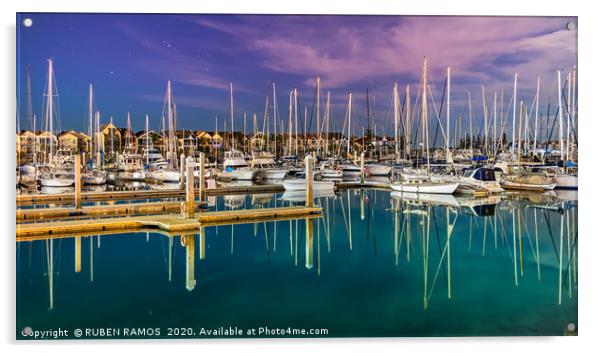 Sailboats moored on a peaceful bay at night. Acrylic by RUBEN RAMOS