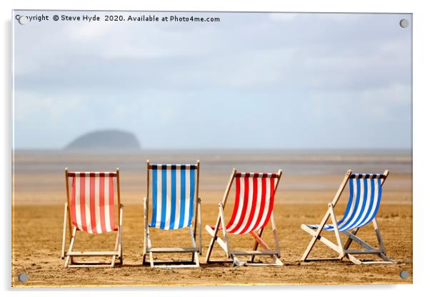 Colourful wooden deck chairs on a beach Acrylic by Steve Hyde