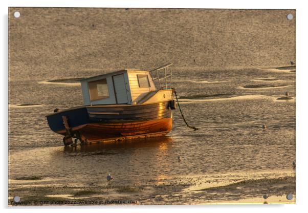 Moored boat illuminated by the rays of the setting sun on the shoal during low tide Acrylic by Q77 photo