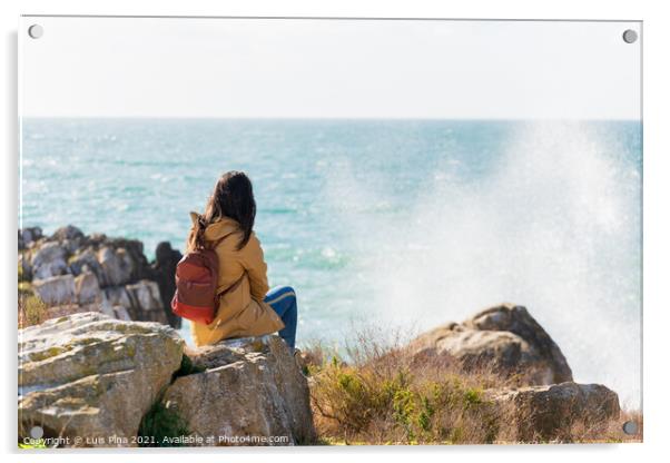 Caucasian traveler woman looking at the waves on the sea with a yellow jacket in Peniche, Portugal Acrylic by Luis Pina