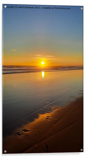 Wide sand beach reflecting orange sunset sunlight. Acrylic by Hanif Setiawan