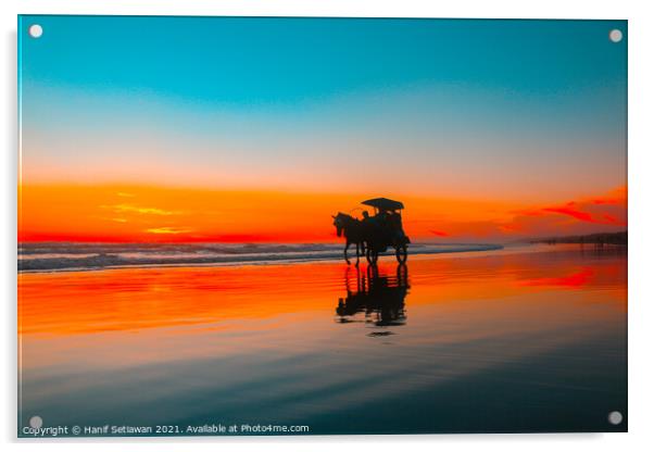 Horse-drawn carriage at sunset on beach Acrylic by Hanif Setiawan