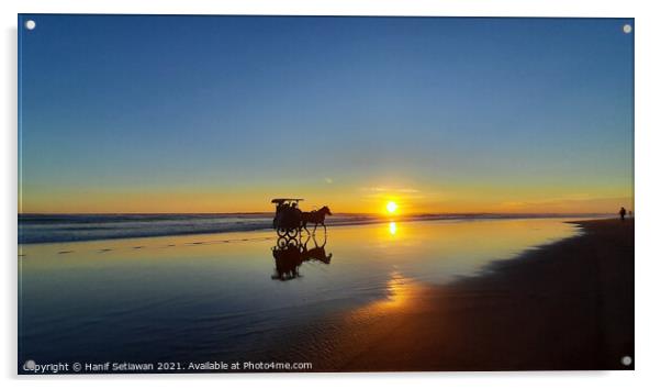 Silhouetted horse-drawn carriage beach sunset 4 Acrylic by Hanif Setiawan