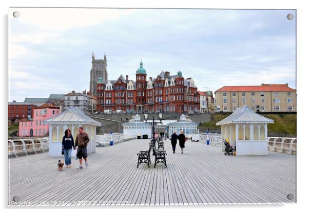 The boardwalk and town from the pier at Cromer in Norfolk.  Acrylic by john hill