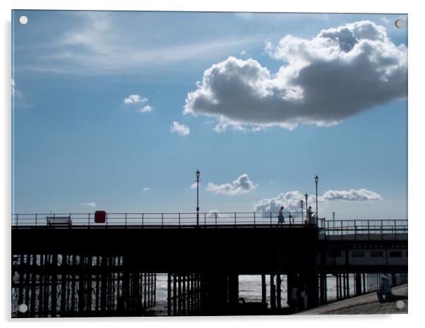 Part of the walkway in silhouette at Southend Pier, Essex, UK, with isolated clouds overhead. Acrylic by Peter Bolton