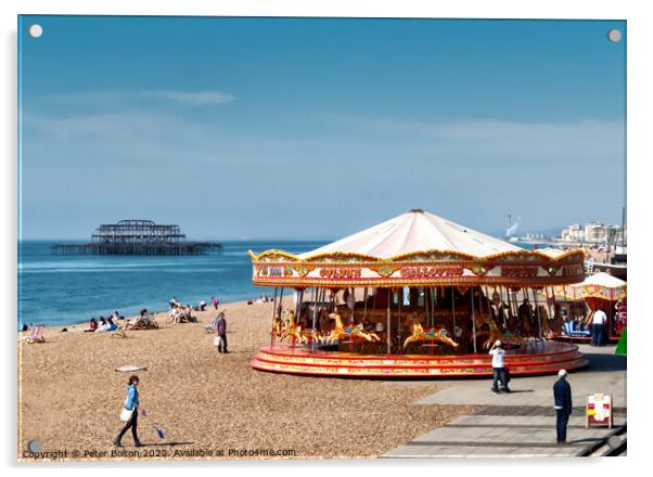 A merry-go-round on Brighton Beach on a summer day with West Pier ruins in the background. Sussex, UK. Acrylic by Peter Bolton