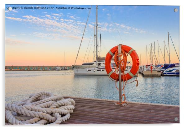 the quay of a marina at  the sunset Acrylic by daniele mattioda