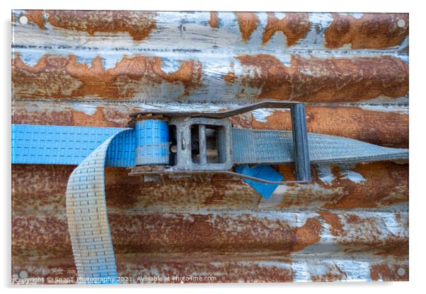 A blue rachet strap wrapped around a rusty corrugated iron metal sheet Acrylic by SnapT Photography