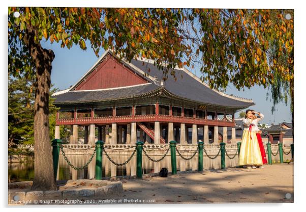 Women dressed in hanbok traditional dresses by the lake at Gyeongbokgung Palace Acrylic by SnapT Photography