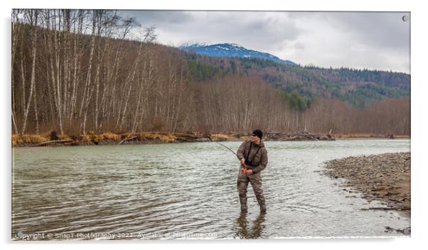 A fly fisherman hooked into a big fish in a river with the rod bent Acrylic by SnapT Photography