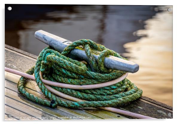Rope tied around a metal bollard mooring on a wooden jetty Acrylic by SnapT Photography