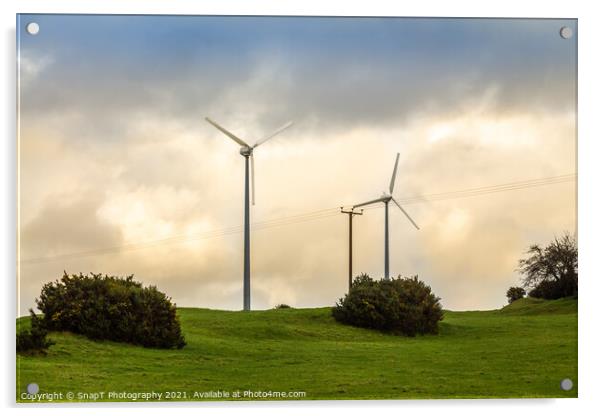 Wind turbines in a green field on the horizon on a cloudy day at sunset Acrylic by SnapT Photography