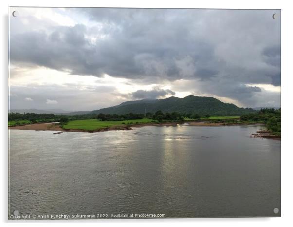 beautiful river near mountain under cloudy sky and a rice field Acrylic by Anish Punchayil Sukumaran