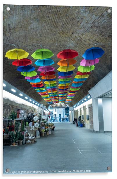 An array of colourful umbrellas at London Bridge Station. Acrylic by johnseanphotography 